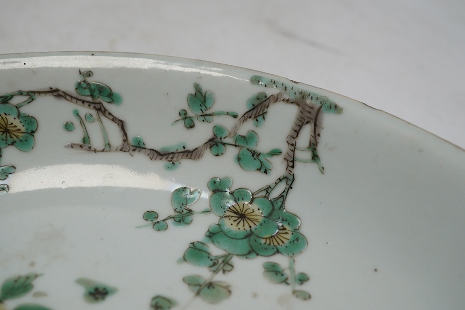 A Chinese famille verte dish, Kangxi period, 21cm. Condition - rim chips, otherwise fair
